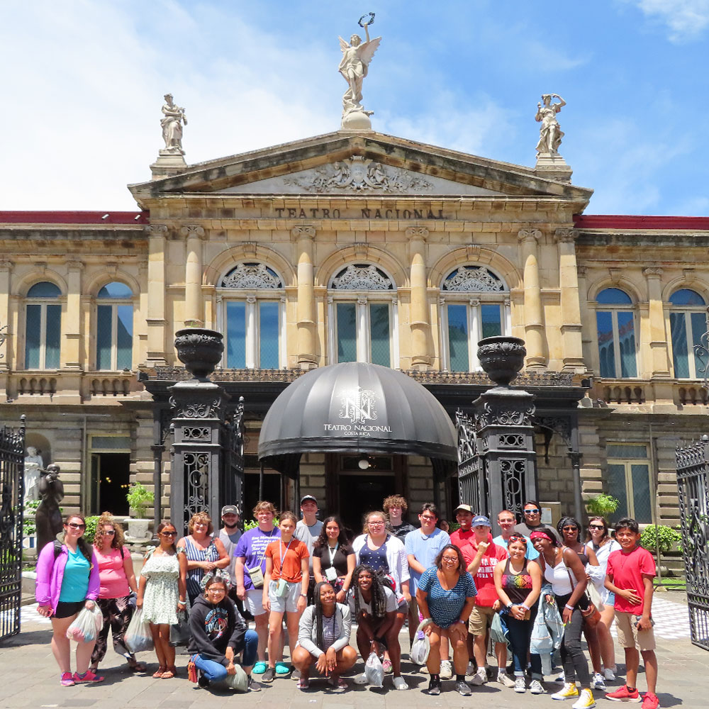 a group of students in front of a Teatro Nacional Costa Rica